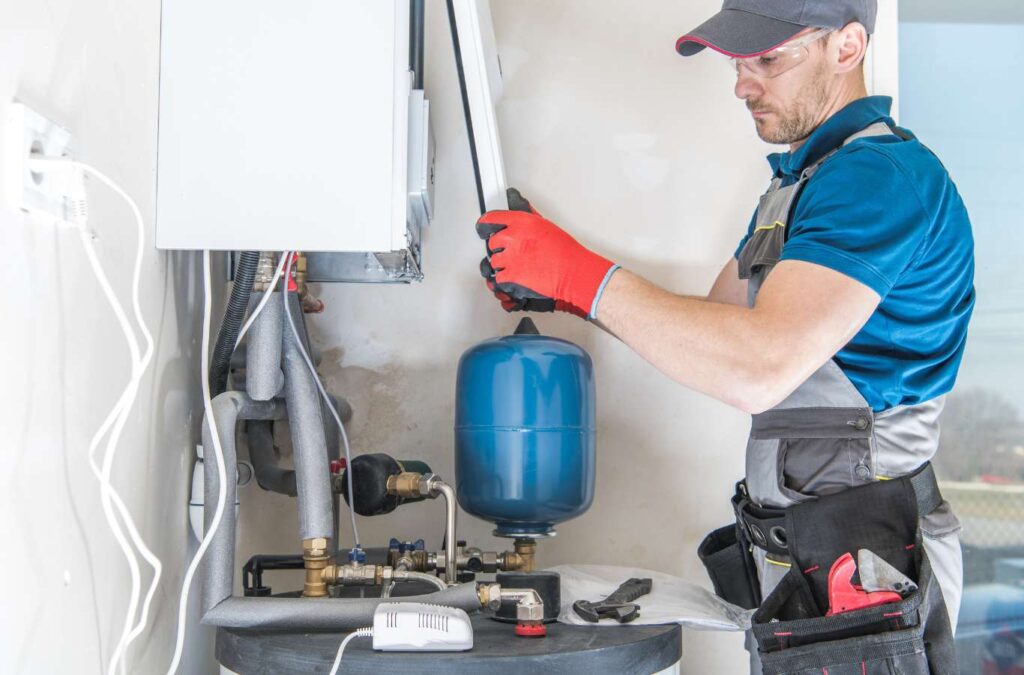 A TAZ Plumbing technician repairing a water heater, ensuring it operates smoothly and efficiently.