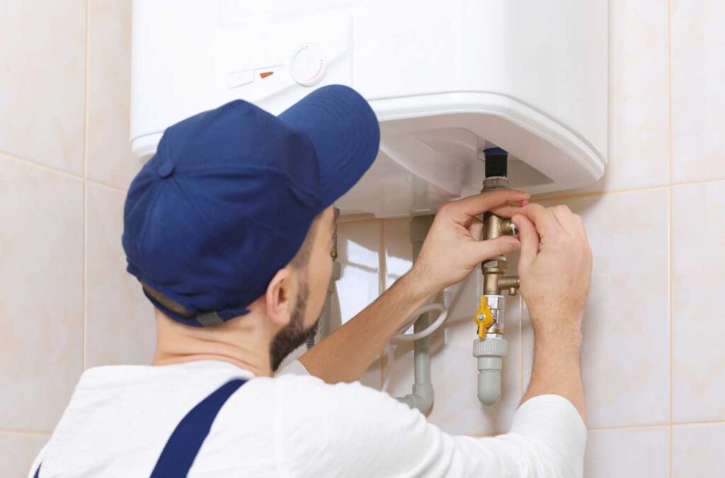 A TAZ Plumbing expert diagnosing a water heater issue in Vail, AZ.