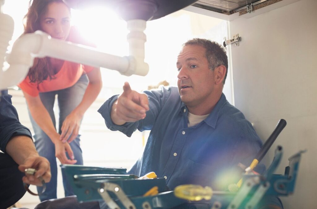 A TAZ Plumbing technician repairing a water pipe to prevent leaks in Vail, AZ.