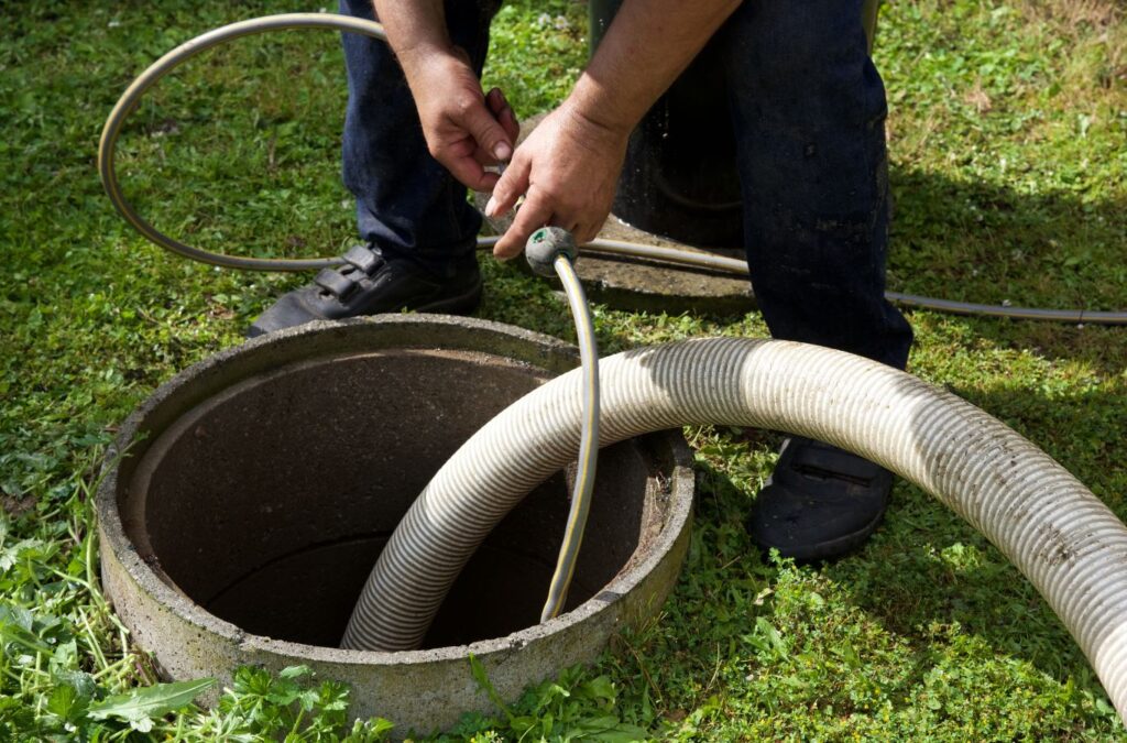 A TAZ Plumbing expert cleaning a sewer drain at a residential property in Vail, AZ.